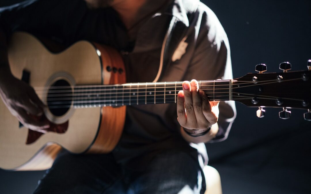 man playing a guitar